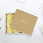 Brown gift box with 'VIETRI' branding on a marble surface