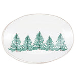 Round ceramic plate with green Christmas tree design on a white background