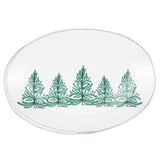 Round ceramic plate with green Christmas tree design on a white background